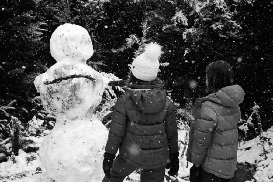 Two children and snow man, Tasmania